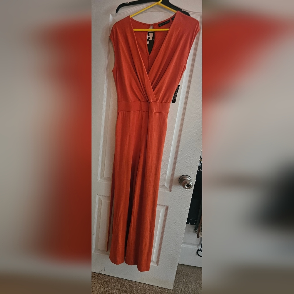 New York and Company orange jumpsuit, size M.